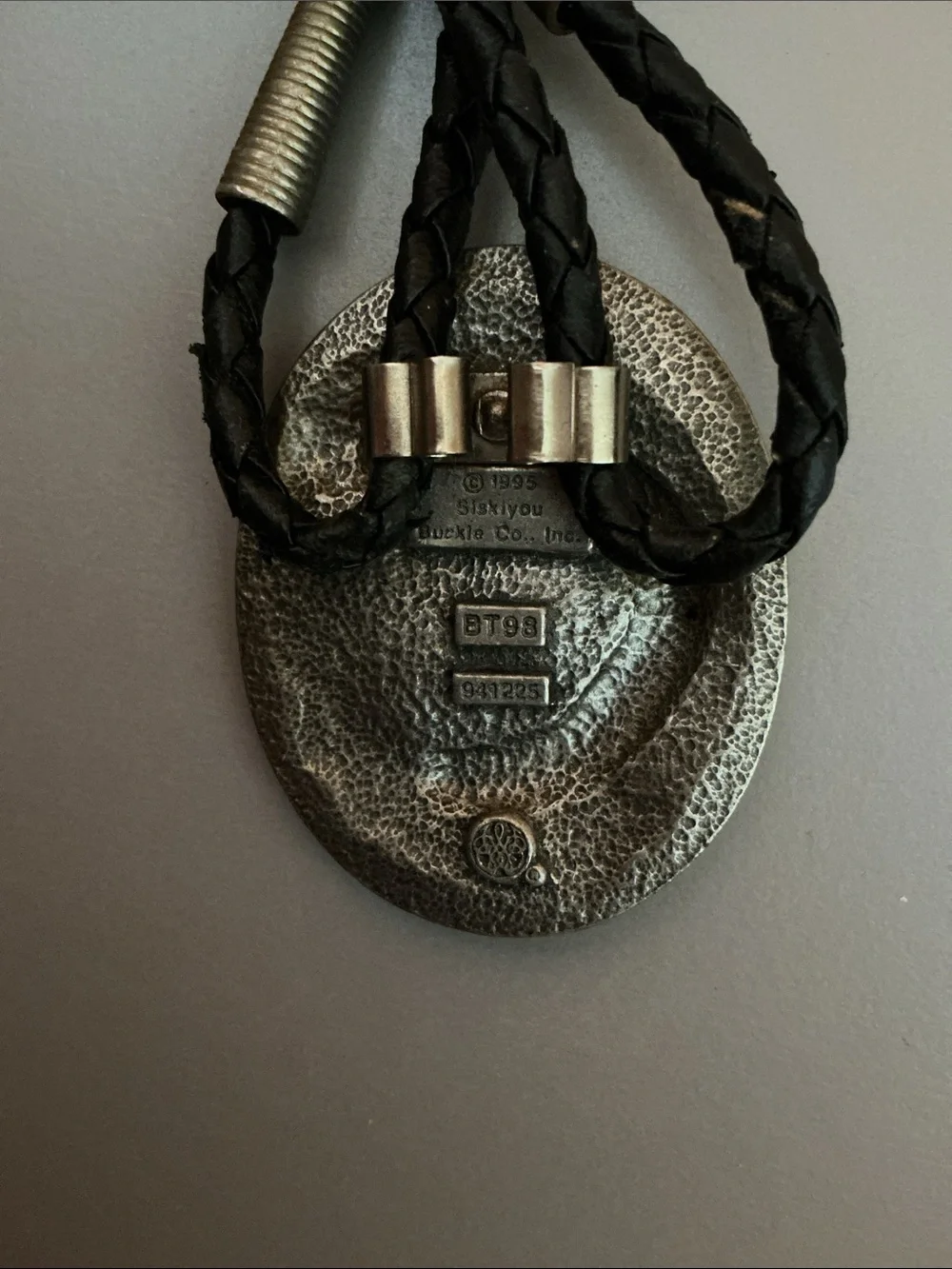 Siskiyou Buckle Co. pewter bolo tie with a braided cord and metal aglets